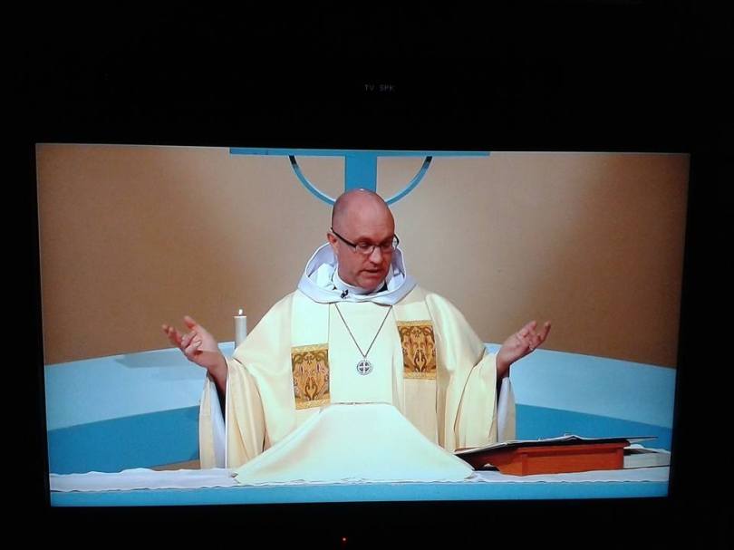 Reverend Forman celebrates the Holy Eucharist.